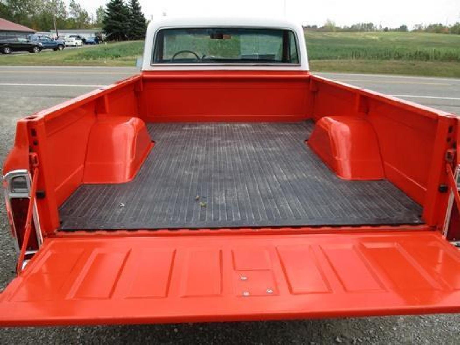 1970 Orange/White Chevrolet C10 with an 328 V8 engine, located at 1725 US-68 N, Bellefontaine, OH, 43311, (937) 592-5466, 40.387783, -83.752388 - 1970 CHEVROLET C10 CUSTOM ½ T Pick-up, High-performance “383 Stroker” V-8 w-headers Auto, Orange w-white Inserts, Black Lth Interior, custom wood steering wheel, PS, PB, Retro AM-FM-CD, gauges, dual exhaust, rally rims w-white letter tires, chrome bumpers & grille, Bed mat.	. Professionally wet - Photo #32