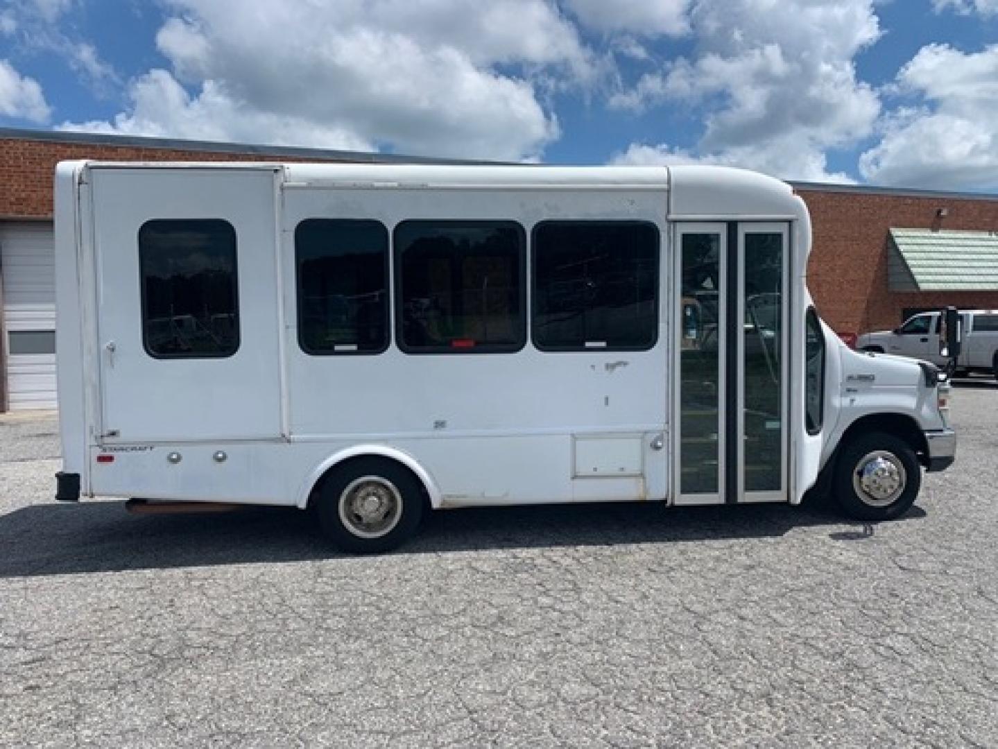 2012 White /Blue Ford E350 with an 5.4L engine, Auto transmission, 0.000000, 0.000000 - 2012 Ford E-350 Starcraft Conversion - 5.4L V8 Gas Engine - Automatic Trans - Electric Entrance Door - 8 Passengers + 2 Wheelchairs - Mid Back Seats - Retractable Seat Belts - Stainless Wheel Simulators - Front and Rear A/C - Handicap Lift - 6 New Tire s - Photo#1