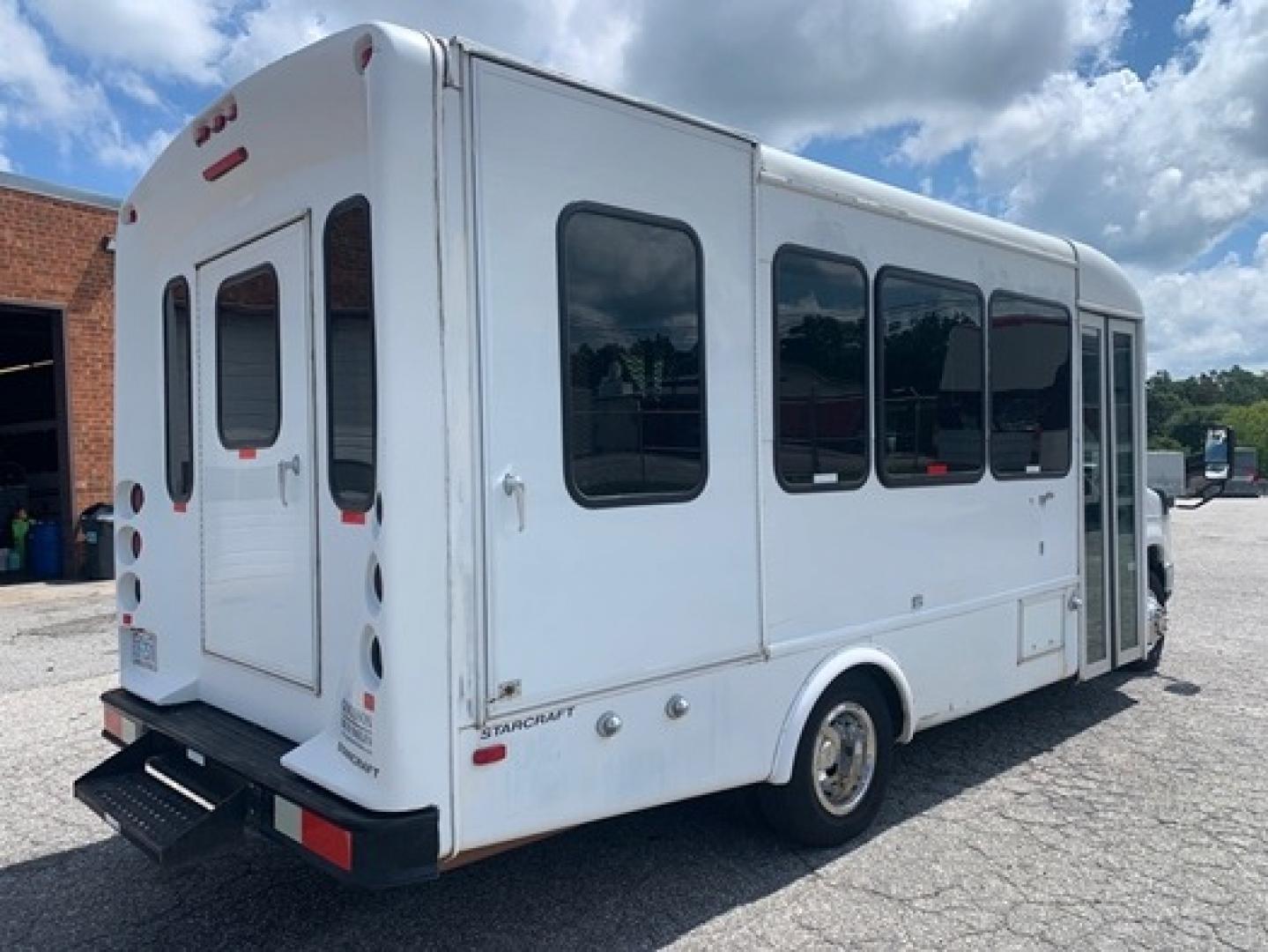 2012 White /Blue Ford E350 with an 5.4L engine, Auto transmission, 0.000000, 0.000000 - 2012 Ford E-350 Starcraft Conversion - 5.4L V8 Gas Engine - Automatic Trans - Electric Entrance Door - 8 Passengers + 2 Wheelchairs - Mid Back Seats - Retractable Seat Belts - Stainless Wheel Simulators - Front and Rear A/C - Handicap Lift - 6 New Tire s - Photo#2