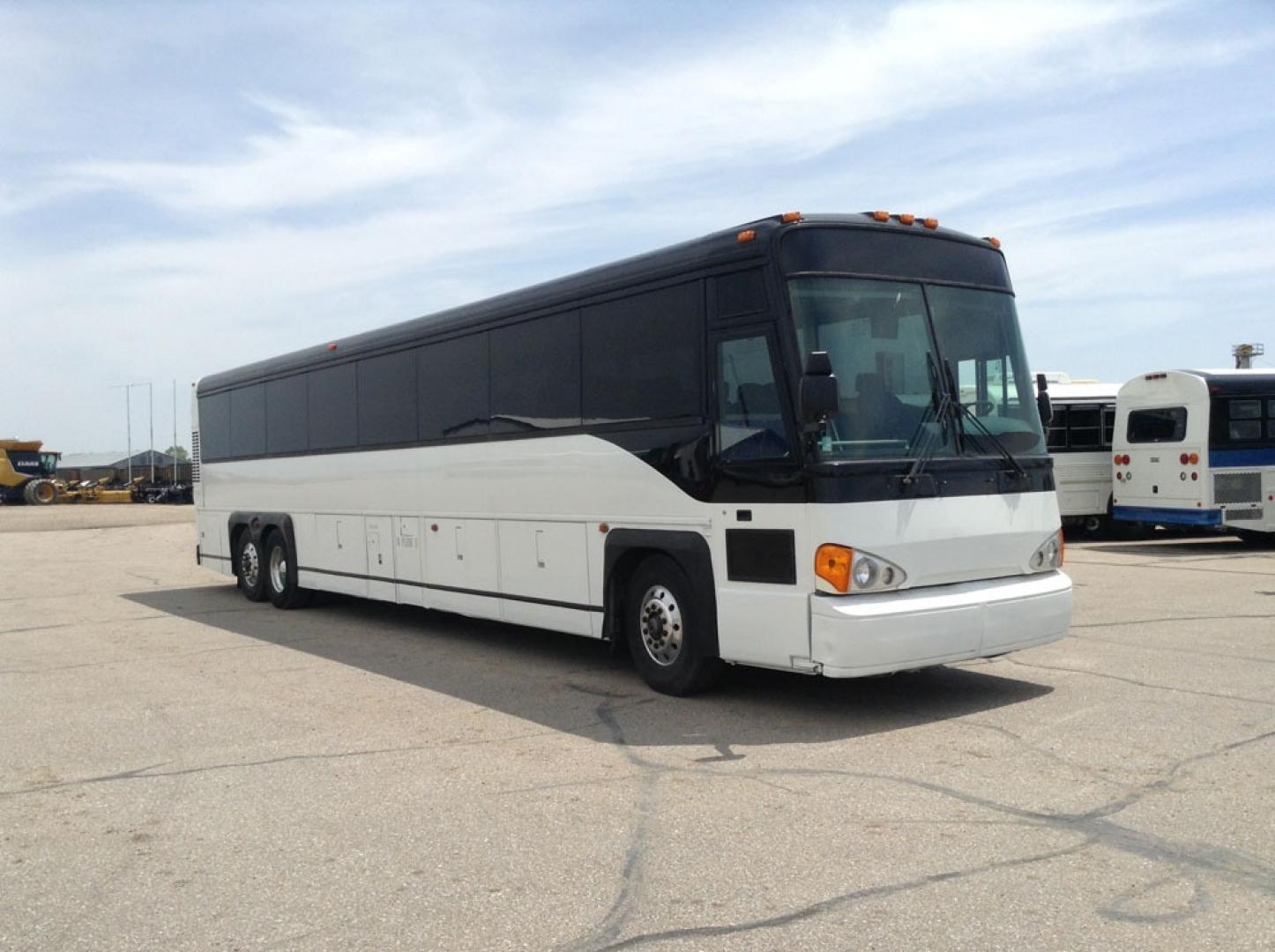 2000 White MCI 102-DL3 with an Detroit Diesel Series 60 engine, Allison transmission, 0.000000, 0.000000 - 2000 MCI 102-DL3 - Series 60 Diesel Engine - Allison Auto Trans. - 45' - 55 Passengers - Flat Screens and DVD - Aluminum Wheels - Enclosed parcel racks – Restroom - New Paint - New Interior - Photo#0