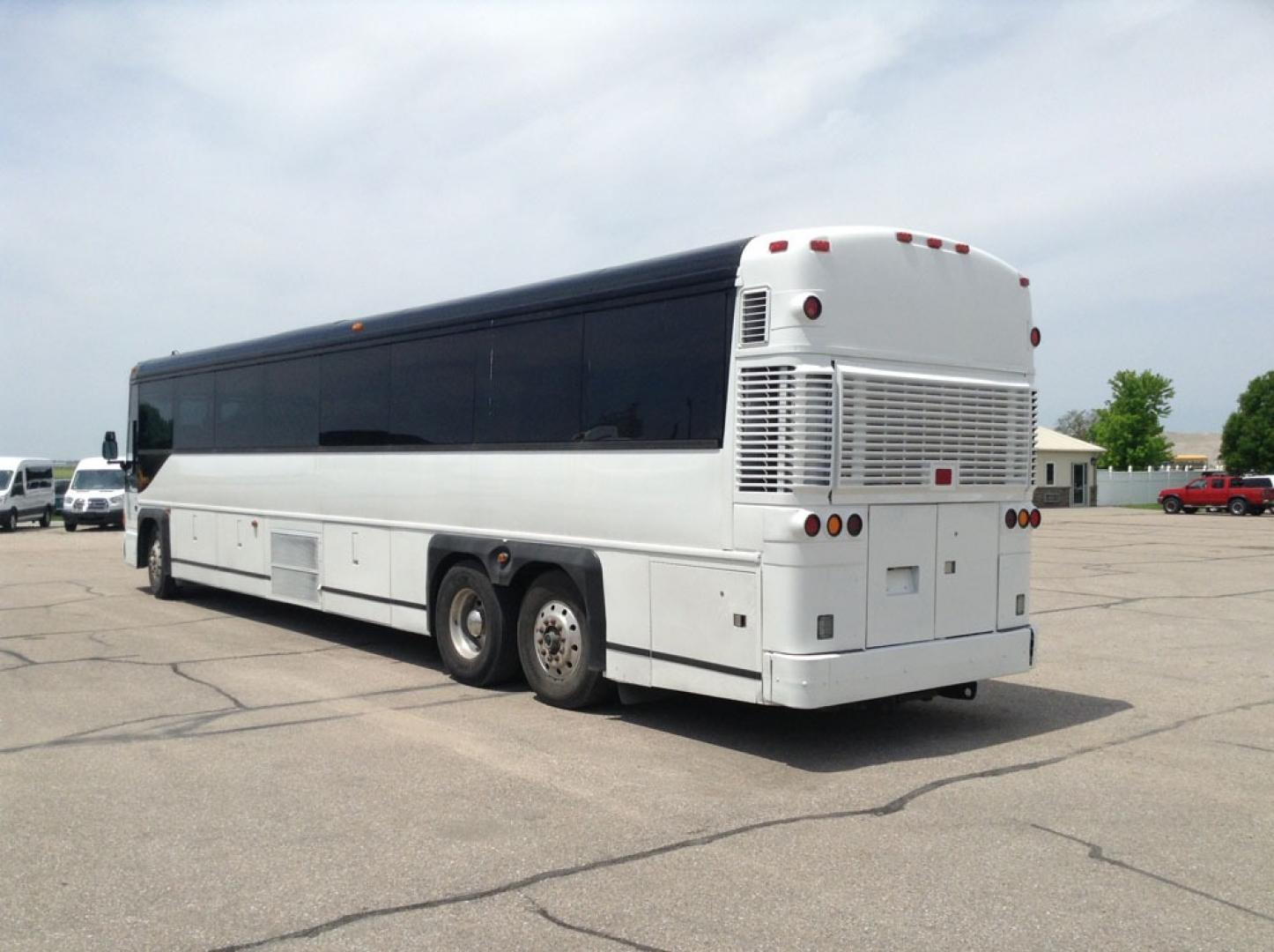 2000 White MCI 102-DL3 with an Detroit Diesel Series 60 engine, Allison transmission, 0.000000, 0.000000 - 2000 MCI 102-DL3 - Series 60 Diesel Engine - Allison Auto Trans. - 45' - 55 Passengers - Flat Screens and DVD - Aluminum Wheels - Enclosed parcel racks – Restroom - New Paint - New Interior - Photo#2