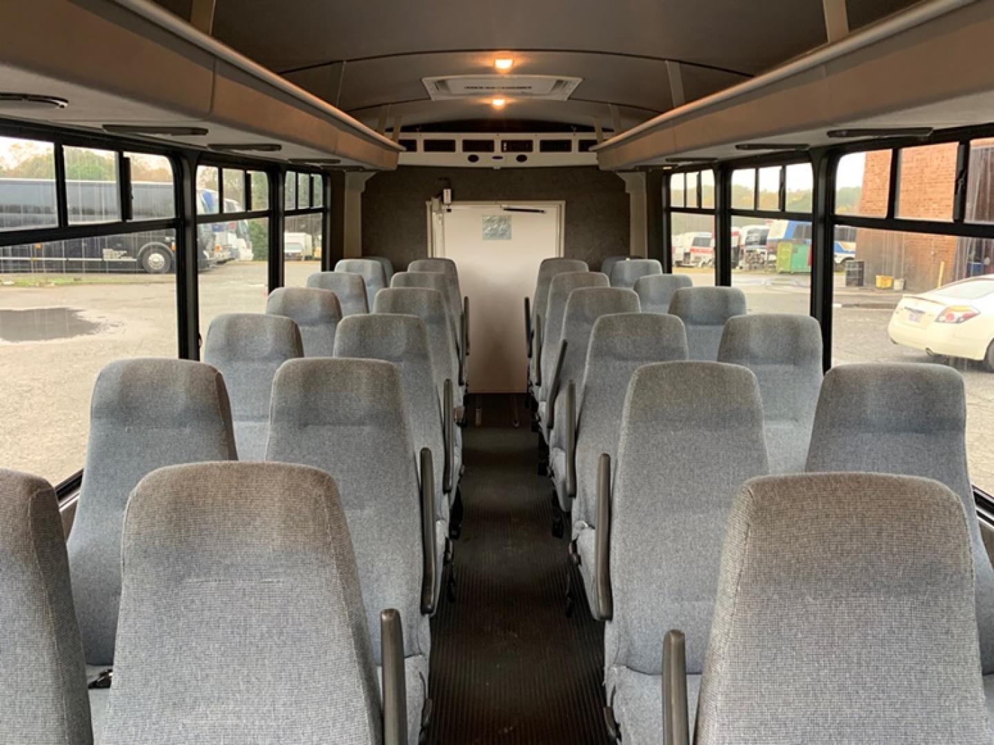 2009 White /Gray Chevrolet C4500 with an Diesel engine, Auto transmission, located at 1725 US-68 N, Bellefontaine, OH, 43311, (937) 592-5466, 40.387783, -83.752388 - 2009 Chevrolet C4500 Champion Conversion – 6.6L Duramax Diesel Engine, Allison Automatic Trans, 28 Passengers + Driver, High Back Reclining Seats, Retractable Seat Belts, Aisle Sliders, Electric Entrance Door, Overhead Luggage Racks, Reading Lights, Front & Rear A/C. Stainless Wheel Simulators 6 N - Photo#11