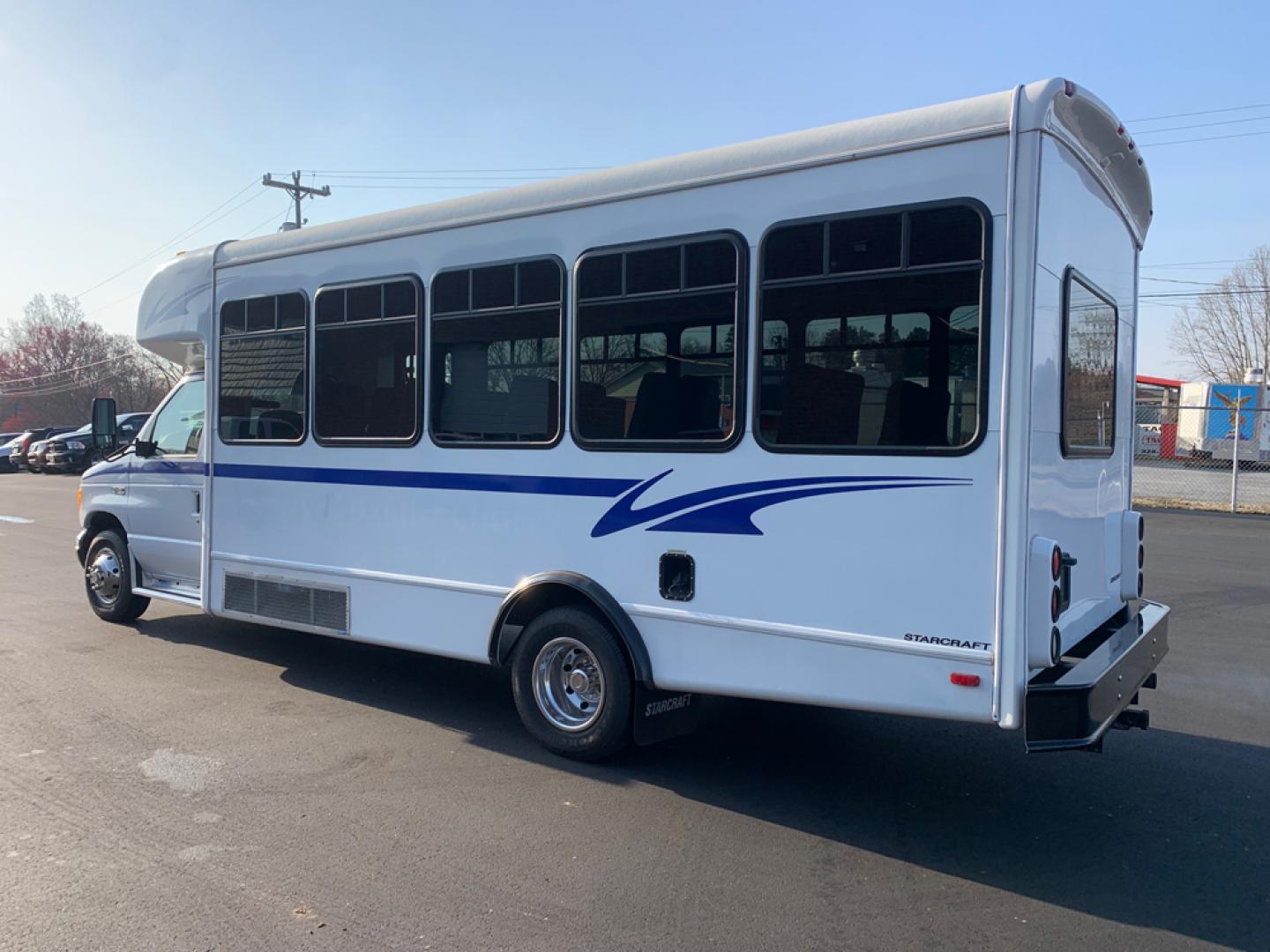 2004 White Ford E450 with an 6.8L V10 engine, Auton transmission, 0.000000, 0.000000 - 2004 Ford E-450 – 6.8L V10 – Auto – Electric Entrance Door – 25 passengers + Driver – High Back Reclining Seats – Aisle Sliders – Overhead Luggage – Reading Lights – Stainless Wheel Simulators – Front/Rear AC- Rear Door - Photo#4