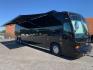 2006 Black MCI E4500 with an Caterpillar D13 Diesel engine, Allison transmission, 0.000000, 0.000000 - 2006 MCI – Caterpillar D13 Diesel, Allison Trans, 45’ Long, Front Lounge, Kitchen, Bath w/Shower, Rear Lounge (could convert to Bedroom), Closet Space, 2 Electric Awnings, 2 Roof A/C w/Heat Strips, 20KW EPS Diesel Generators, Aluminum Wheels, Interior by Amadas, One Owner, Garage Kept. - Photo#0