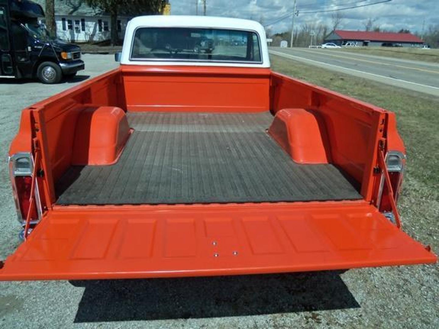 1970 Orange/White Chevrolet C10 with an 328 V8 engine, located at 1725 US-68 N, Bellefontaine, OH, 43311, (937) 592-5466, 40.387783, -83.752388 - 1970 CHEVROLET C10 CUSTOM ½ T Pick-up, High-performance “383 Stroker” V-8 w-headers Auto, Orange w-white Inserts, Black Lth Interior, custom wood steering wheel, PS, PB, Retro AM-FM-CD, gauges, dual exhaust, rally rims w-white letter tires, chrome bumpers & grille, Bed mat.	. Professionally wet - Photo#7